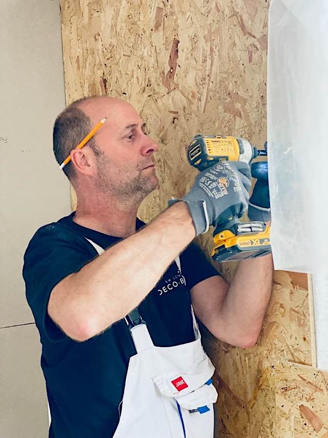 Decobuild staff working on cladding